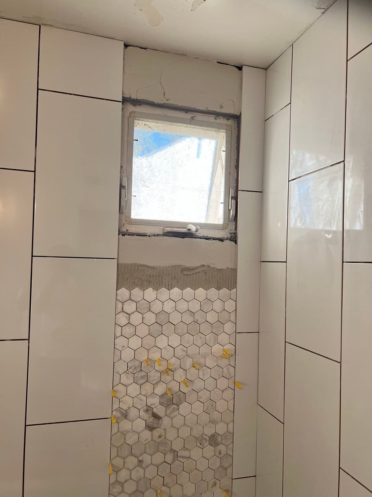 Before — Shower accent wall: tile going up to finished