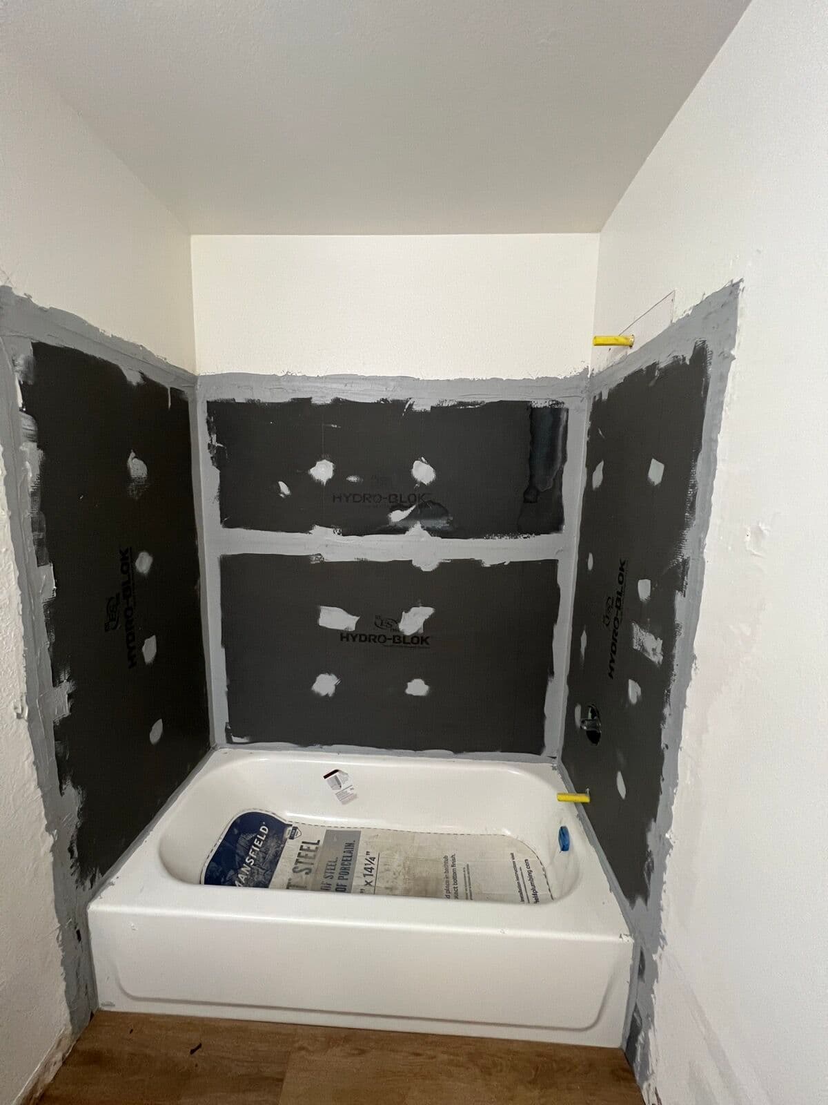 Before — Tub surround: waterproofing to wall panels