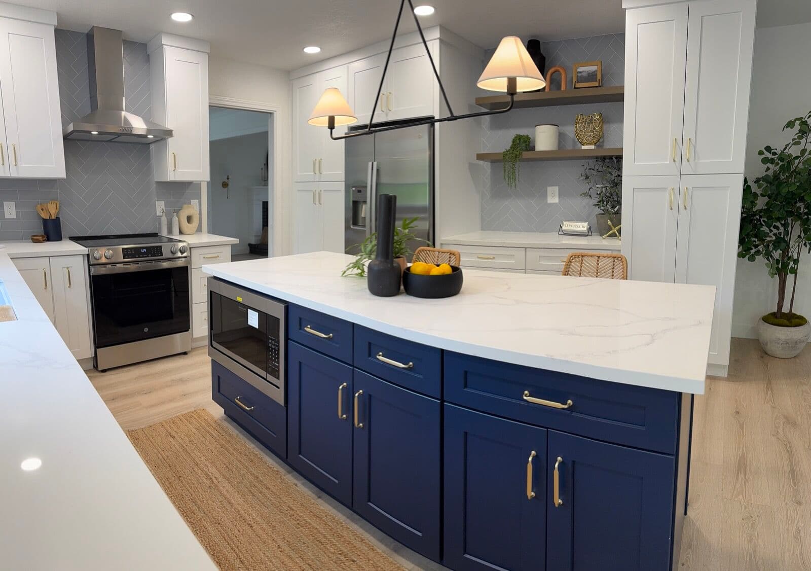 Navy shaker island against white uppers, two finishes of the same door style