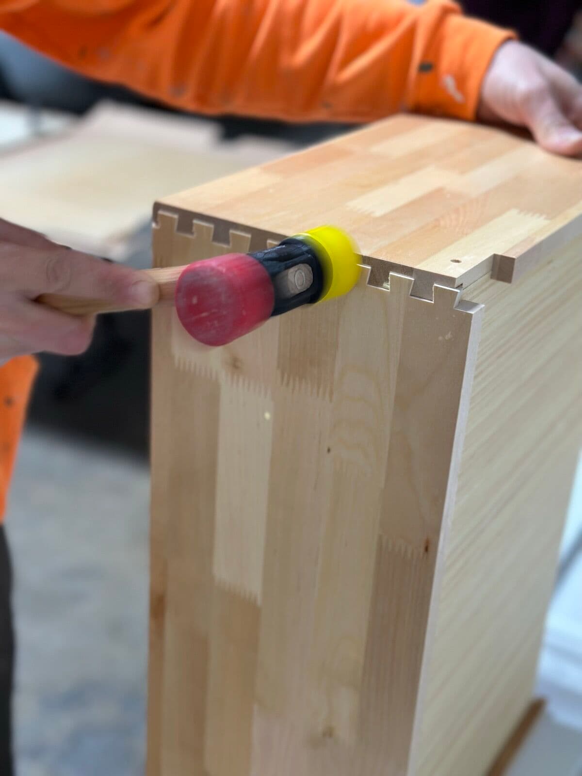 A finger-jointed solid wood drawer box being assembled in the OTG warehouse